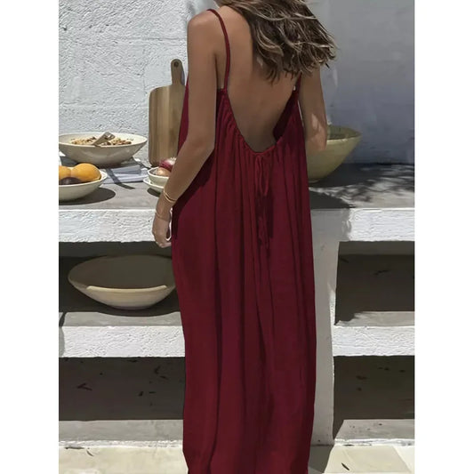 Robe dos nu ajustable NAÏADE Alba, vêtement d'été en tissu léger avec décolleté dans le dos et cordons réglables.